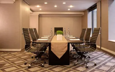 a conference room with a long table and chairs at Park Central Hotel New York in New York
