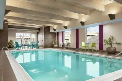 a large pool with blue water in a hotel room at Home2 Suites By Hilton Ridley Park Philadelphia Airport So in Ridley Park