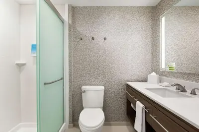 a bathroom with a toilet and a sink and a shower at Home2 Suites By Hilton Ridley Park Philadelphia Airport So in Ridley Park
