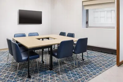 a conference room with a table and chairs at Courtyard New York Downtown Manhattan/Financial District in New York
