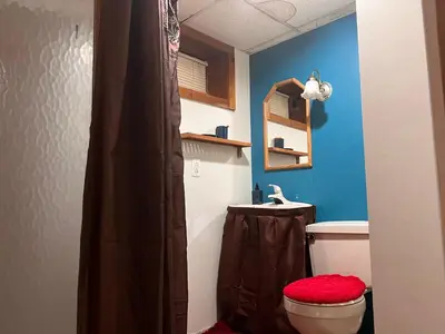 a bathroom with a toilet and a sink at Garden Suite 30 Mins to NYC, Mins to EWR, Prudential Center, NJPACK in Belleville