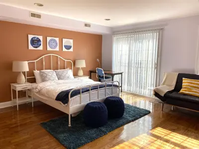 a bedroom with a bed and a couch and a chair at AF Stays - Philadelphia 1210 Mt Vernon St in Philadelphia