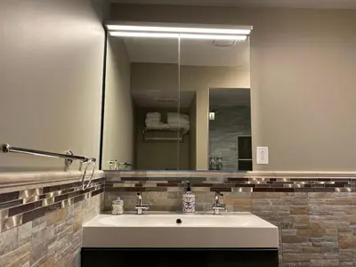 a bathroom with a sink and a large mirror at AF Stays - Philadelphia 1210 Mt Vernon St in Philadelphia