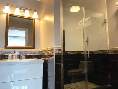 a bathroom with a shower and a sink and a mirror at AF Stays - Philadelphia 1210 Mt Vernon St in Philadelphia