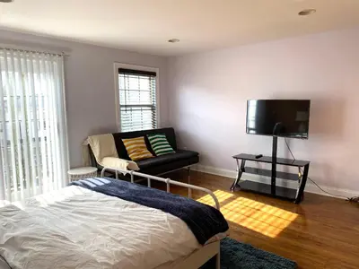 a bedroom with a bed and a couch and a tv at AF Stays - Philadelphia 1210 Mt Vernon St in Philadelphia