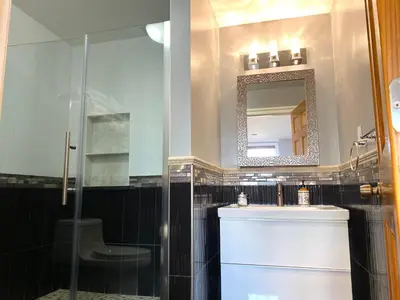 a bathroom with a shower and a sink and a mirror at AF Stays - Philadelphia 1210 Mt Vernon St in Philadelphia