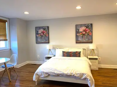 a bedroom with a bed and two paintings on the wall at AF Stays - Philadelphia 1210 Mt Vernon St in Philadelphia