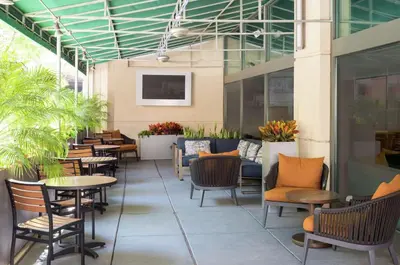 a patio with tables and chairs in a building at Hampton Inn Philadelphia Center City-Convention Center in Philadelphia