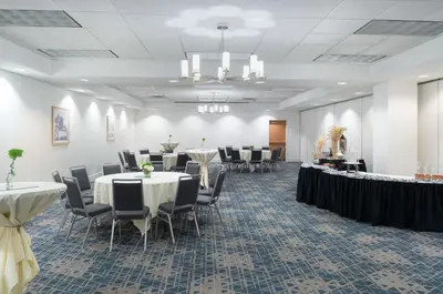 a conference room with tables and chairs in a room at Hampton Inn Philadelphia Center City-Convention Center in Philadelphia