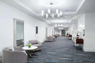 a waiting room with couches and tables and a chandelier at Hampton Inn Philadelphia Center City-Convention Center in Philadelphia