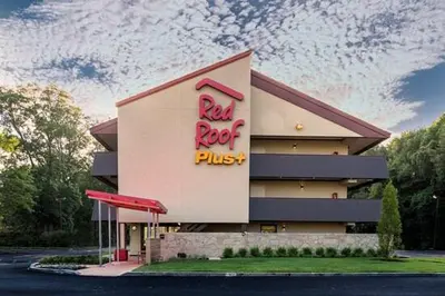 a building with a red rock plus sign on it at Red Roof Inn PLUS+ Philadelphia Airport in Essington