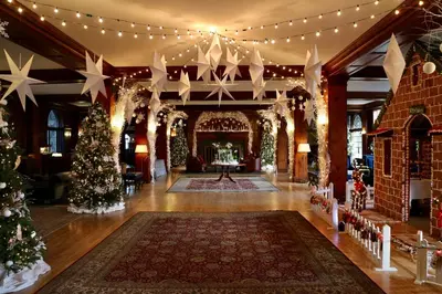 a room filled with christmas trees and christmas lights at Skytop Lodge in Skytop