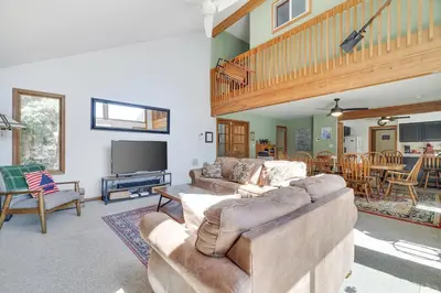 a living room with two couches and a television at Mt. Maplewood Lake House in Blakeslee