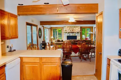 a kitchen and dining room with a table and chairs at Mt. Maplewood Lake House Apt. in Blakeslee
