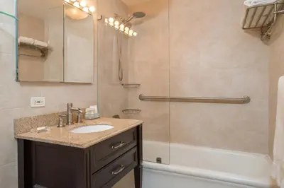 a bathroom with a sink and a shower at Lombardy Hotel in New York