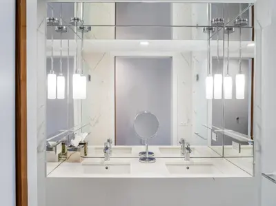 a bathroom with three sinks and a mirror at 33 Hotel, New York City, Seaport in New York