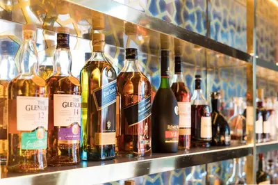 a bunch of bottles of wine on a shelf at 33 Hotel, New York City, Seaport in New York