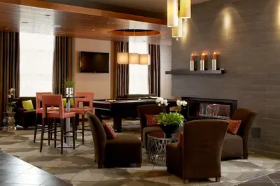 a lobby with a living room with a piano at Hyatt House Philadelphia-King of Prussia in King of Prussia