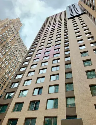 a tall building with many windows on it at DoubleTree by Hilton New York Times Square South in New York