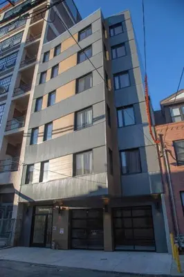 a tallartment building with two garage at Poor Richard Studio at Kestrel Hotel in Philadelphia
