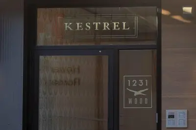 a sign on the door of a building at Inquirer Studio at Kestrel Hotel in Philadelphia