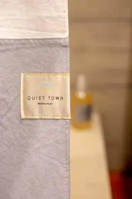 a sign that says quiet town on a wall at Inquirer Studio at Kestrel Hotel in Philadelphia