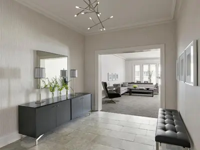 a living room with a black dresser and a mirror at AKA Rittenhouse Square in Philadelphia