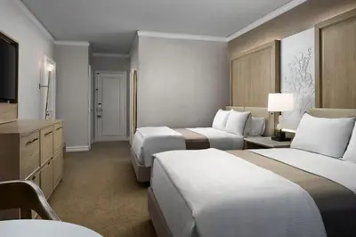 a hotel room with two beds and a television at The Westin Philadelphia in Philadelphia