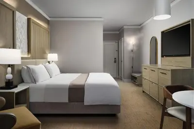 a hotel room with a large bed and a television at The Westin Philadelphia in Philadelphia