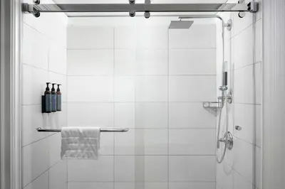 a shower with a glass door and a towel at The Westin Philadelphia in Philadelphia