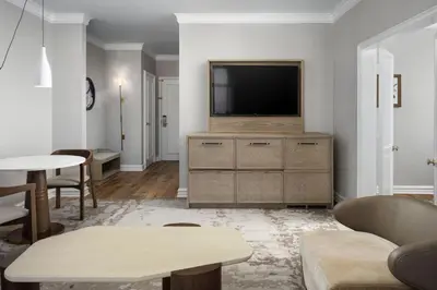 a living room with a television on a dresser at The Westin Philadelphia in Philadelphia
