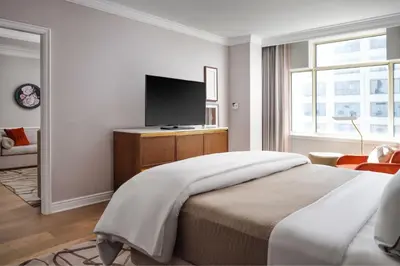 a bedroom with a bed and a flat screen tv at The Westin Philadelphia in Philadelphia