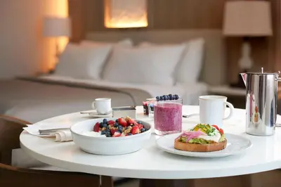 a table with a plate of food and a bowl of fruit at The Westin Philadelphia in Philadelphia