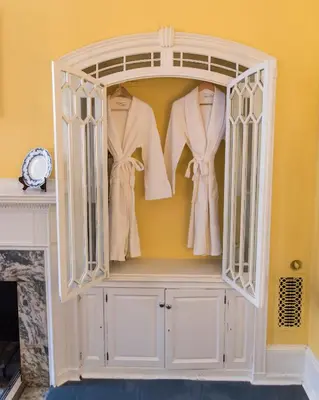 a large white hanger with clothes in it at La Reserve Bed and Breakfast in Philadelphia
