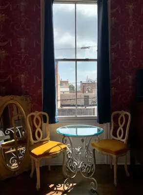 a room with a table and two chairs and a window at The Philadelphia Hotel Bella Vista in Philadelphia