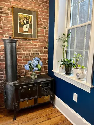 an old stove in a room with a brick wall at The Philadelphia Hotel Bella Vista in Philadelphia