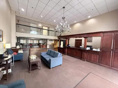 a large living room with a couch and a chandelier at Comfort Inn Feasterville - Trevose in Trevose