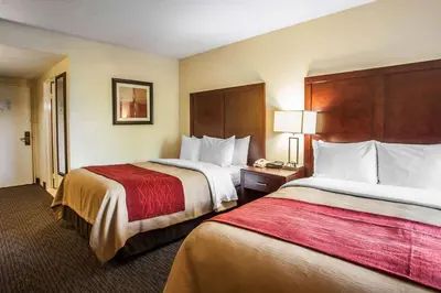 a hotel room with two beds and a telephone at Comfort Inn Feasterville - Trevose in Trevose