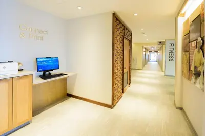 a corridor of a office with a computer on a counter at Fairfield Inn & Suites Scranton Montage Mountain in Moosic