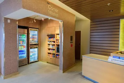 a grocery store with a counter and a refrigerator at Fairfield Inn & Suites Scranton Montage Mountain in Moosic