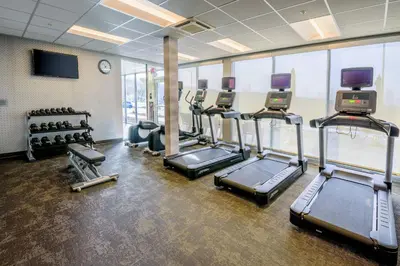 a gym with treadmills and a row of treadms at Fairfield Inn & Suites Scranton Montage Mountain in Moosic