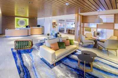 a living room with a couch and a table at Fairfield Inn & Suites Scranton Montage Mountain in Moosic