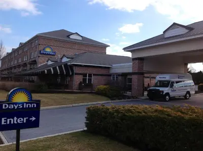 a ups truck parked in front of a building at Days Inn by Wyndham Hershey in Hershey