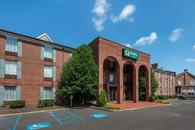 a brick building with a cisco sign in a parking lot at Quality Inn Montgomeryville-Philadelphia in Montgomeryville