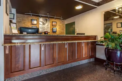 a bar in a restaurant with a plant at Quality Inn Montgomeryville-Philadelphia in Montgomeryville