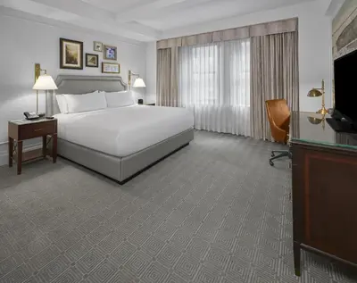 a hotel room with a bed and a television at InterContinental New York Barclay Hotel by IHG in New York