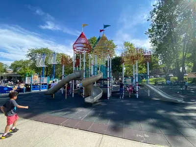 a playground with a slide in a park at Cozy apt in WEST NY, NEW JERSEY, at 2 bloks from bus stop-15 minutes 2NY 7MINUTES VIA NYWATERWAY FERRY-BETTER CAN'T BE!! in West New York