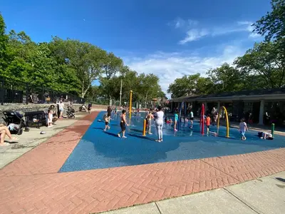 a group of people playing on a playground at Cozy apt in WEST NY, NEW JERSEY, at 2 bloks from bus stop-15 minutes 2NY 7MINUTES VIA NYWATERWAY FERRY-BETTER CAN'T BE!! in West New York
