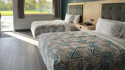 a hotel room with two beds and a window at Motel 6 East Windsor, NJ Hightstown in East Windsor