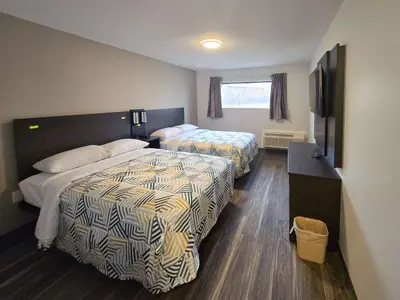 a hotel room with two beds and a television at Motel 6 East Windsor, NJ Hightstown in East Windsor